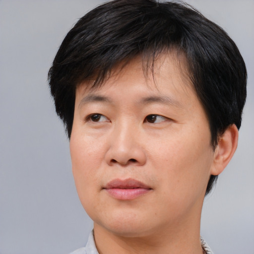 Neutral asian young-adult male with short  brown hair and brown eyes