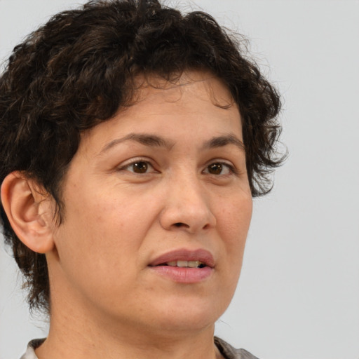 Joyful white adult female with short  brown hair and brown eyes