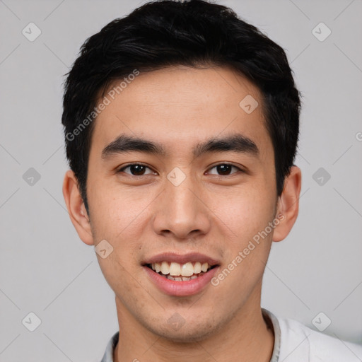 Joyful white young-adult male with short  black hair and brown eyes