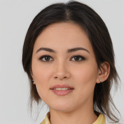 Joyful asian young-adult female with medium  brown hair and brown eyes