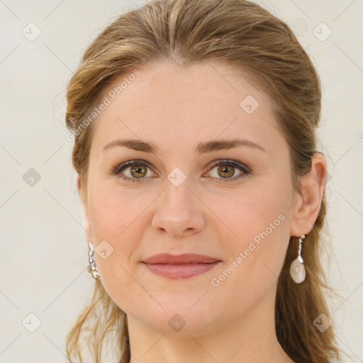 Joyful white young-adult female with medium  brown hair and blue eyes