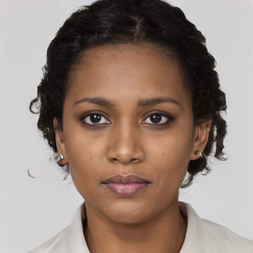 Neutral black young-adult female with short  black hair and brown eyes