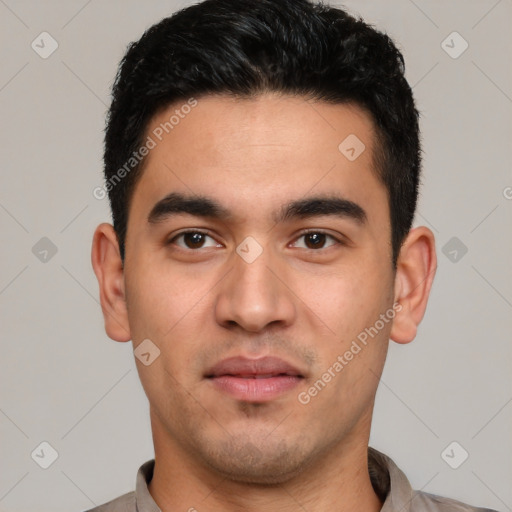 Joyful white young-adult male with short  black hair and brown eyes