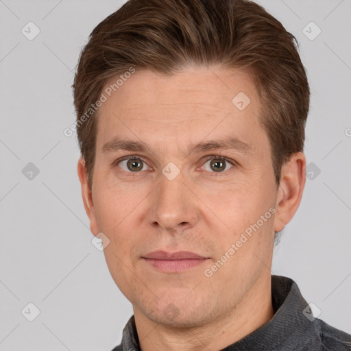 Joyful white adult male with short  brown hair and grey eyes