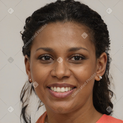 Joyful black young-adult female with medium  brown hair and brown eyes