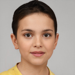 Joyful white child female with short  brown hair and brown eyes