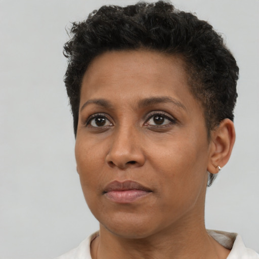 Neutral black young-adult female with short  brown hair and brown eyes