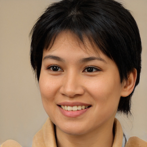 Joyful asian young-adult female with medium  brown hair and brown eyes