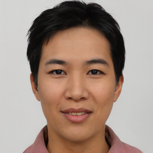 Joyful asian young-adult female with short  black hair and brown eyes