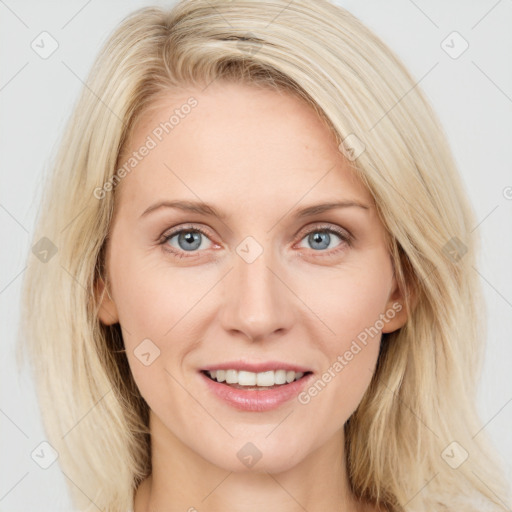 Joyful white young-adult female with long  brown hair and blue eyes