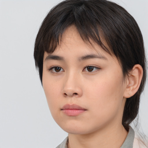 Neutral asian young-adult female with medium  brown hair and brown eyes