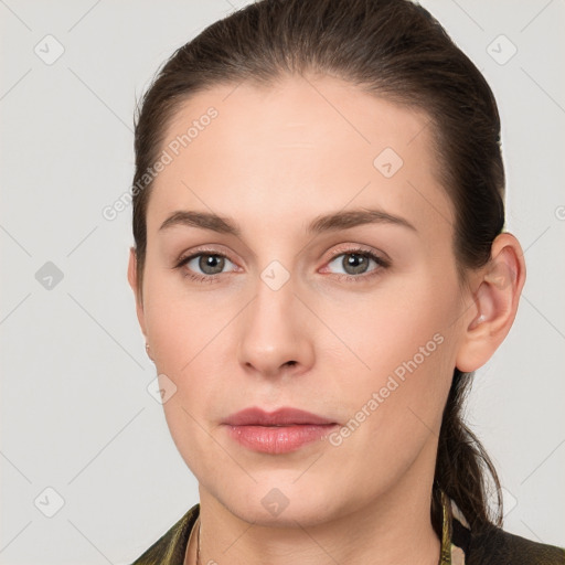 Neutral white young-adult female with long  brown hair and grey eyes