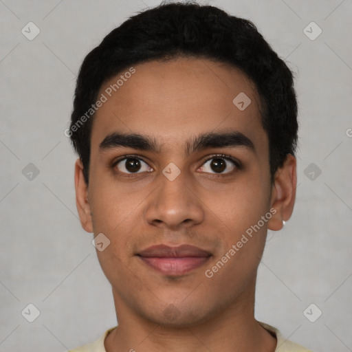 Joyful latino young-adult male with short  black hair and brown eyes