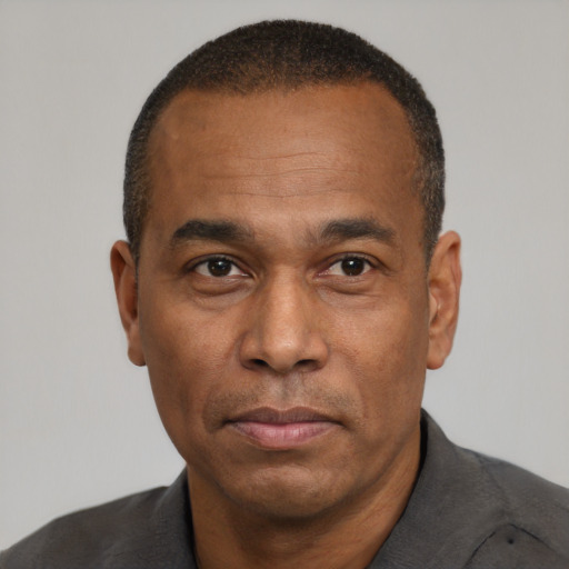 Neutral black adult male with short  black hair and brown eyes