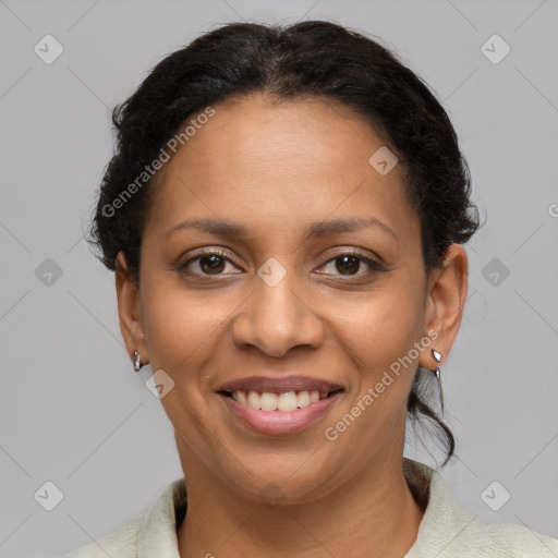 Joyful latino adult female with short  brown hair and brown eyes