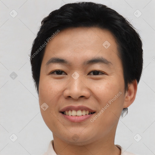 Joyful asian young-adult male with short  brown hair and brown eyes