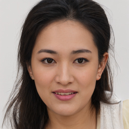 Joyful white young-adult female with long  brown hair and brown eyes