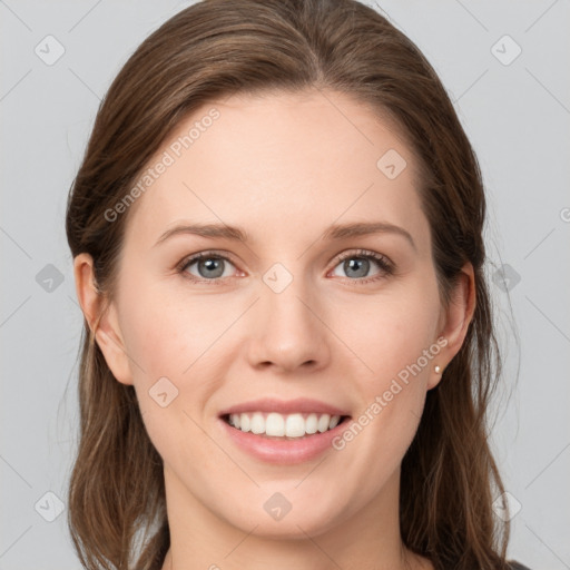 Joyful white young-adult female with long  brown hair and grey eyes