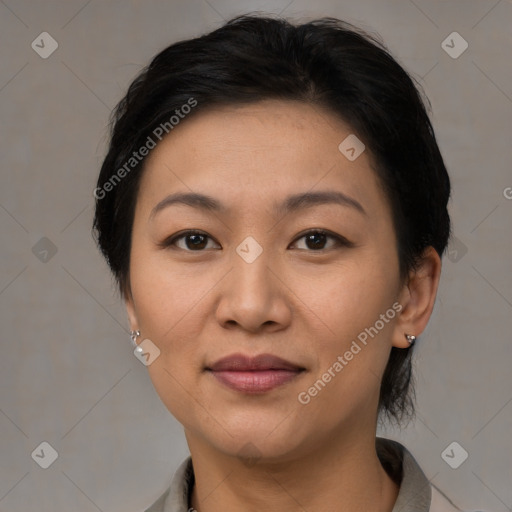 Joyful latino young-adult female with short  brown hair and brown eyes