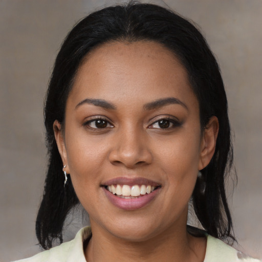 Joyful latino young-adult female with medium  black hair and brown eyes