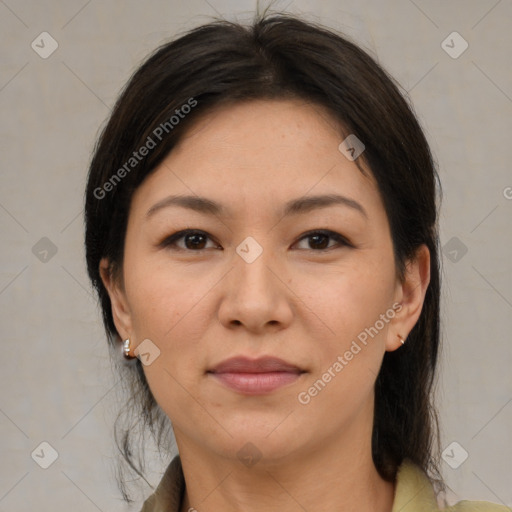 Joyful white adult female with medium  brown hair and brown eyes