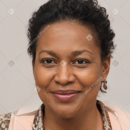 Joyful black adult female with medium  brown hair and brown eyes