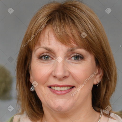 Joyful white adult female with medium  brown hair and blue eyes