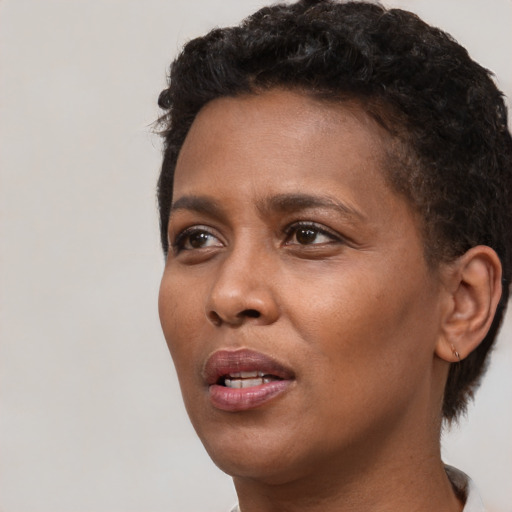 Neutral black young-adult female with short  brown hair and brown eyes