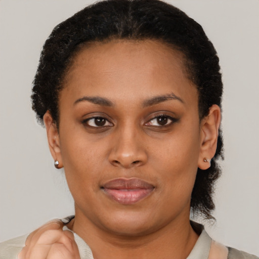 Joyful latino young-adult female with short  brown hair and brown eyes