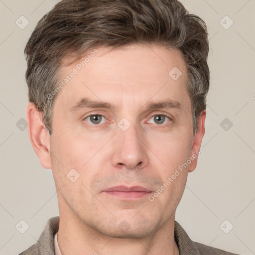 Neutral white adult male with short  brown hair and grey eyes