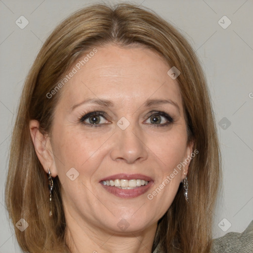 Joyful white adult female with medium  brown hair and blue eyes