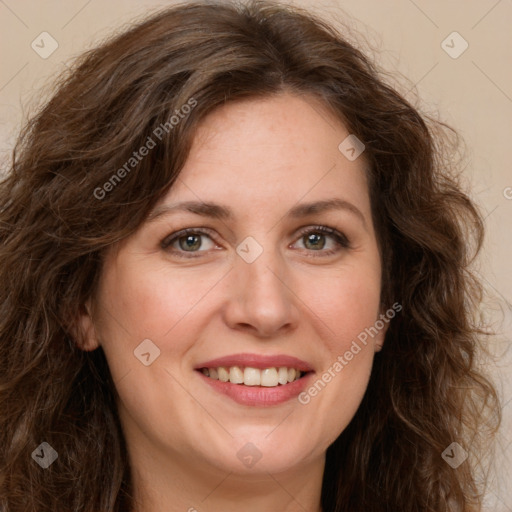 Joyful white adult female with long  brown hair and green eyes