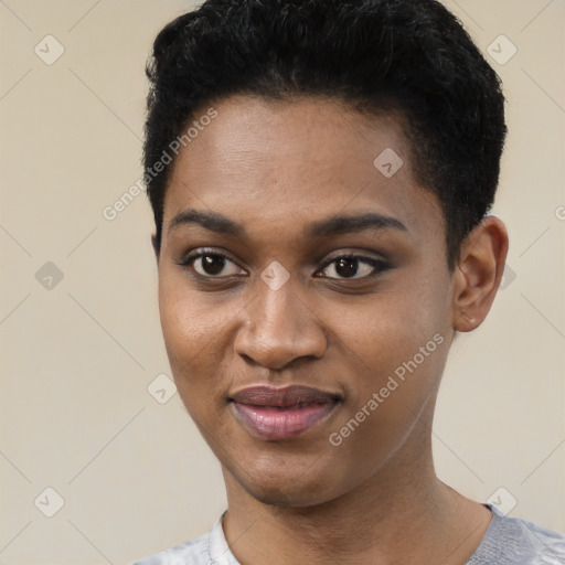 Joyful black young-adult female with short  black hair and brown eyes