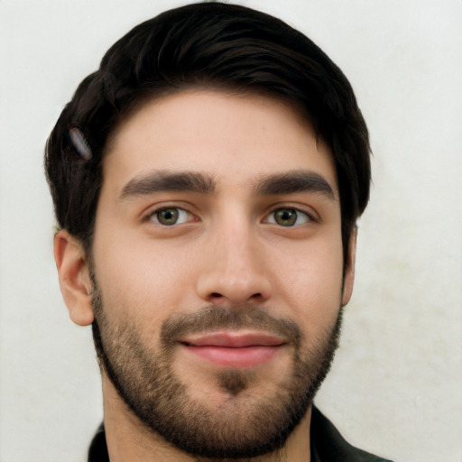 Joyful white young-adult male with short  black hair and brown eyes