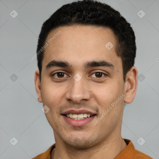 Joyful white young-adult male with short  black hair and brown eyes