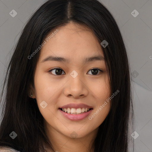 Joyful asian young-adult female with long  brown hair and brown eyes