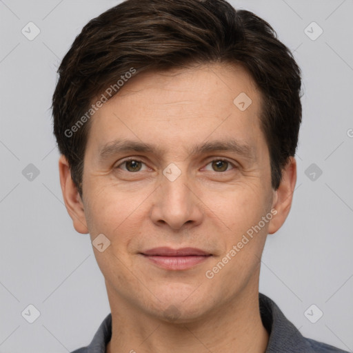 Joyful white adult male with short  brown hair and grey eyes