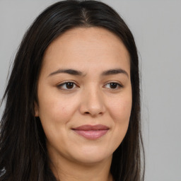 Joyful asian young-adult female with long  brown hair and brown eyes