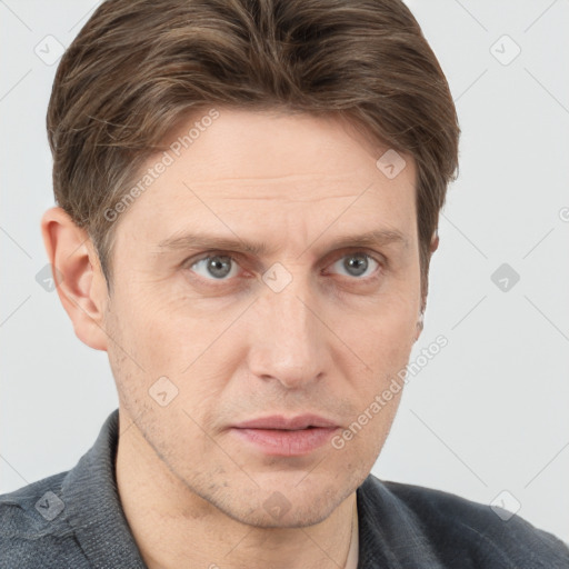 Neutral white adult male with short  brown hair and grey eyes