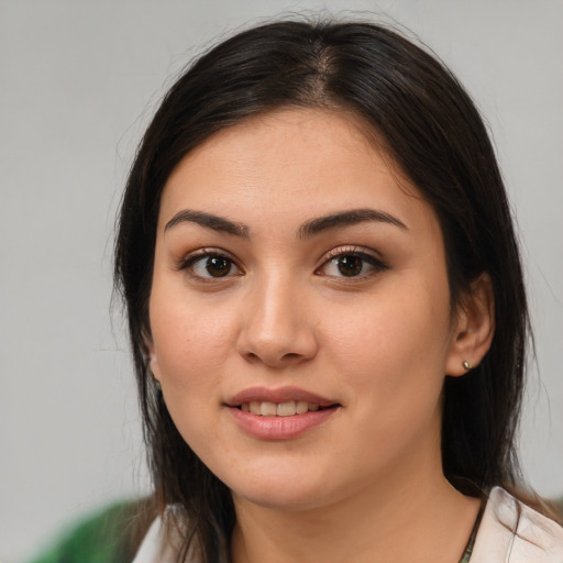 Joyful white young-adult female with medium  brown hair and brown eyes