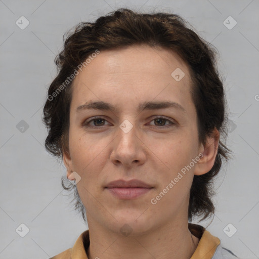 Joyful white adult female with short  brown hair and brown eyes