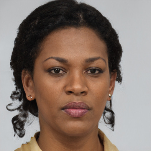 Neutral black young-adult female with long  brown hair and brown eyes
