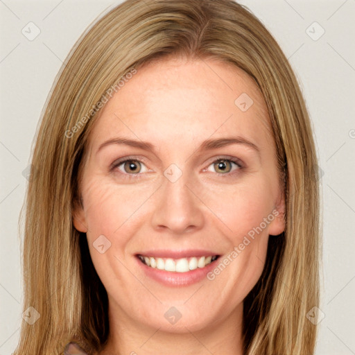 Joyful white young-adult female with long  brown hair and green eyes