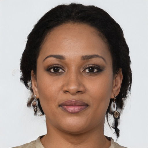Joyful black young-adult female with medium  brown hair and brown eyes