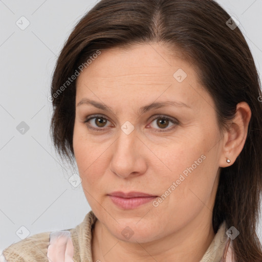 Joyful white adult female with medium  brown hair and brown eyes