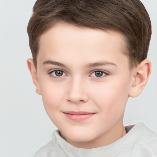 Joyful white child male with short  brown hair and brown eyes