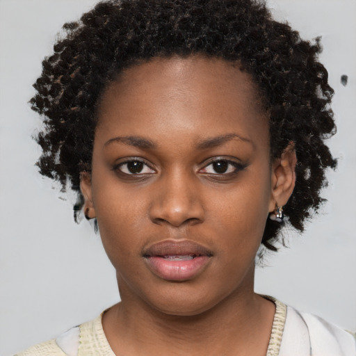 Neutral black young-adult female with short  brown hair and brown eyes