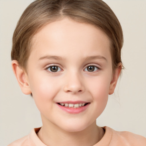 Joyful white child female with short  brown hair and brown eyes