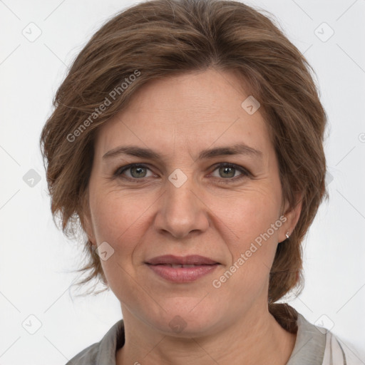 Joyful white adult female with medium  brown hair and grey eyes