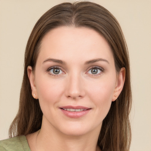 Joyful white young-adult female with long  brown hair and grey eyes